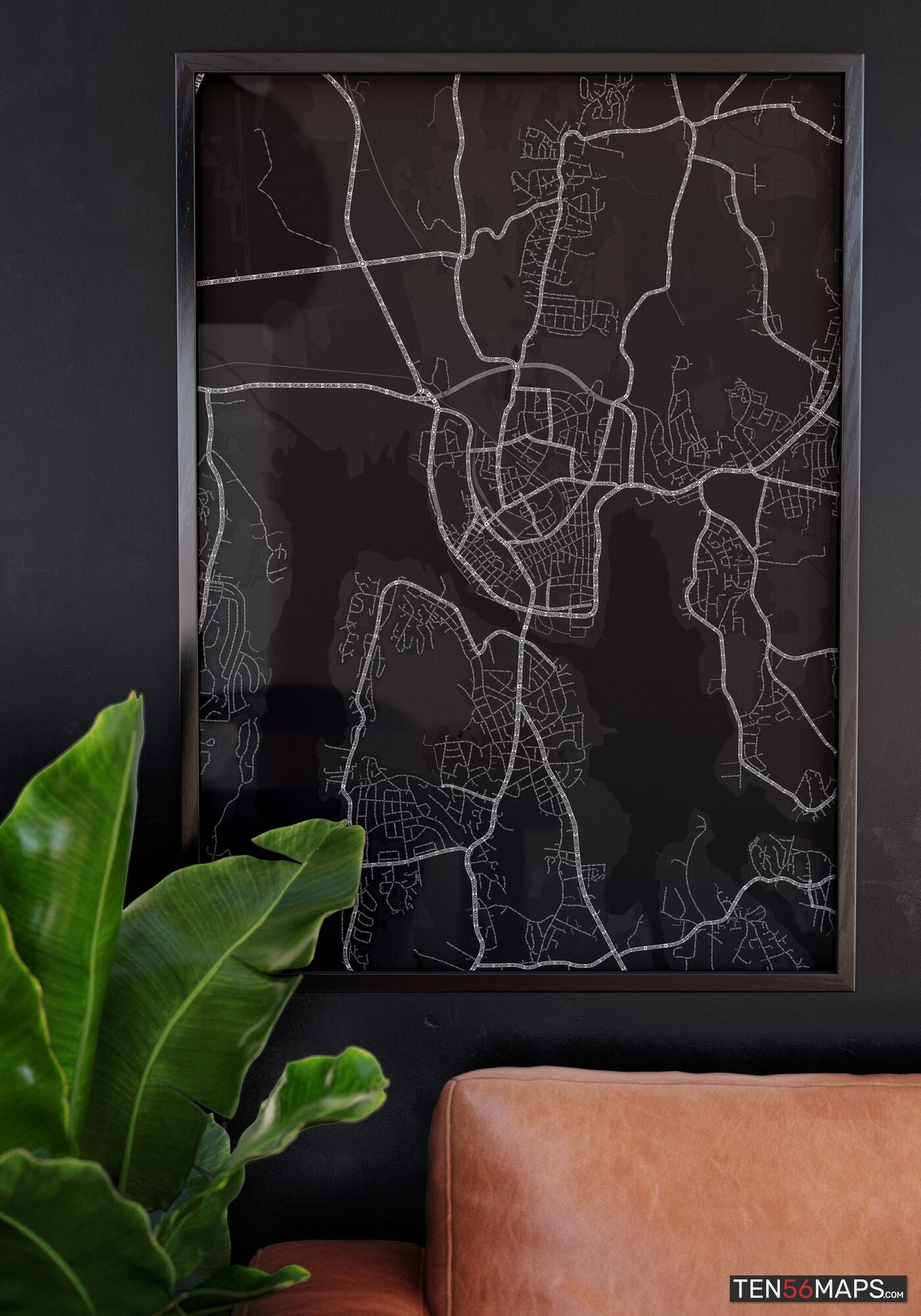 Poster hanging over couch in Onyx color scheme