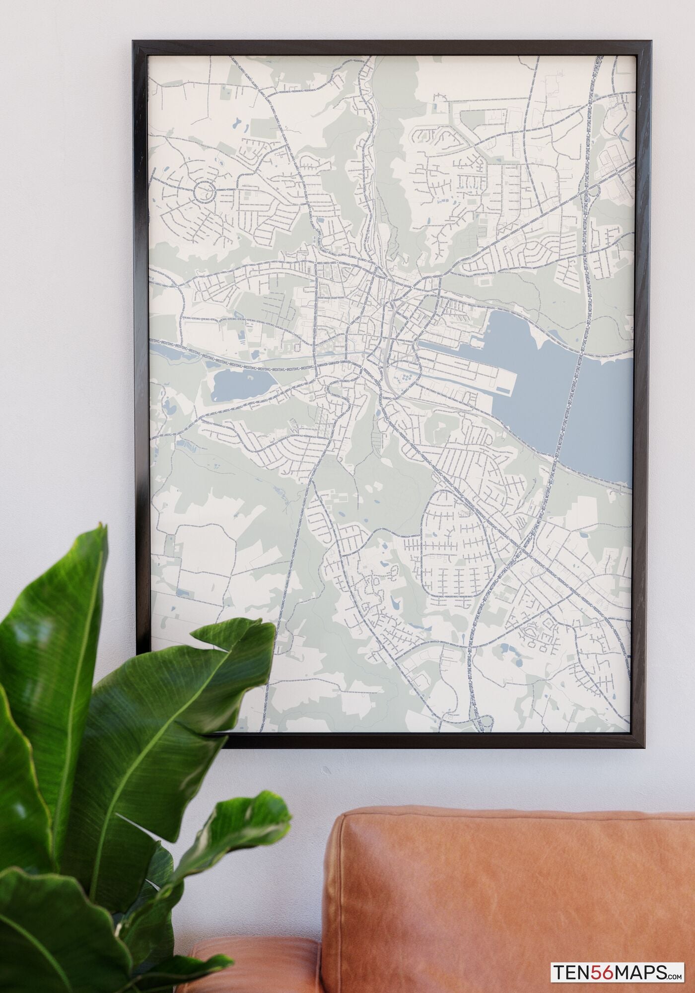 Poster hanging over couch in Earth color scheme