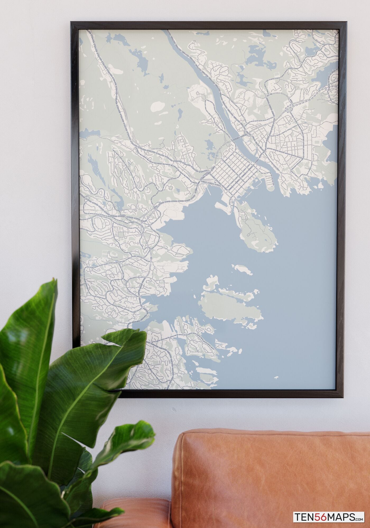 Poster hanging over couch in Earth color scheme