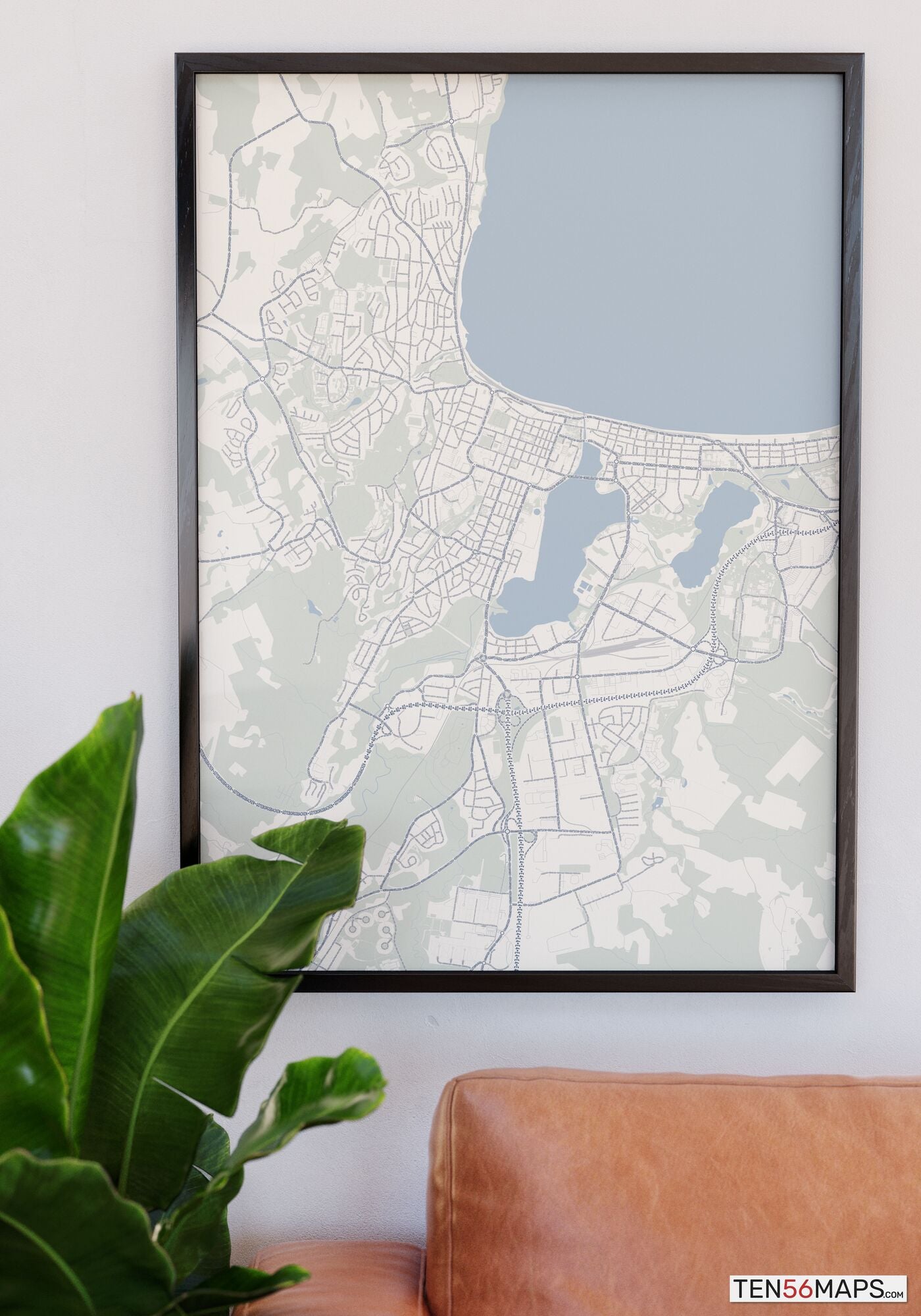 Poster hanging over couch in Earth color scheme